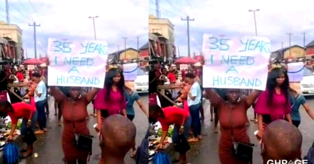 Lady storms the street with a placard to look for a husband